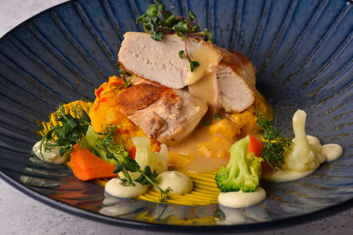 Chicken fillet with carrot puree and vegetables